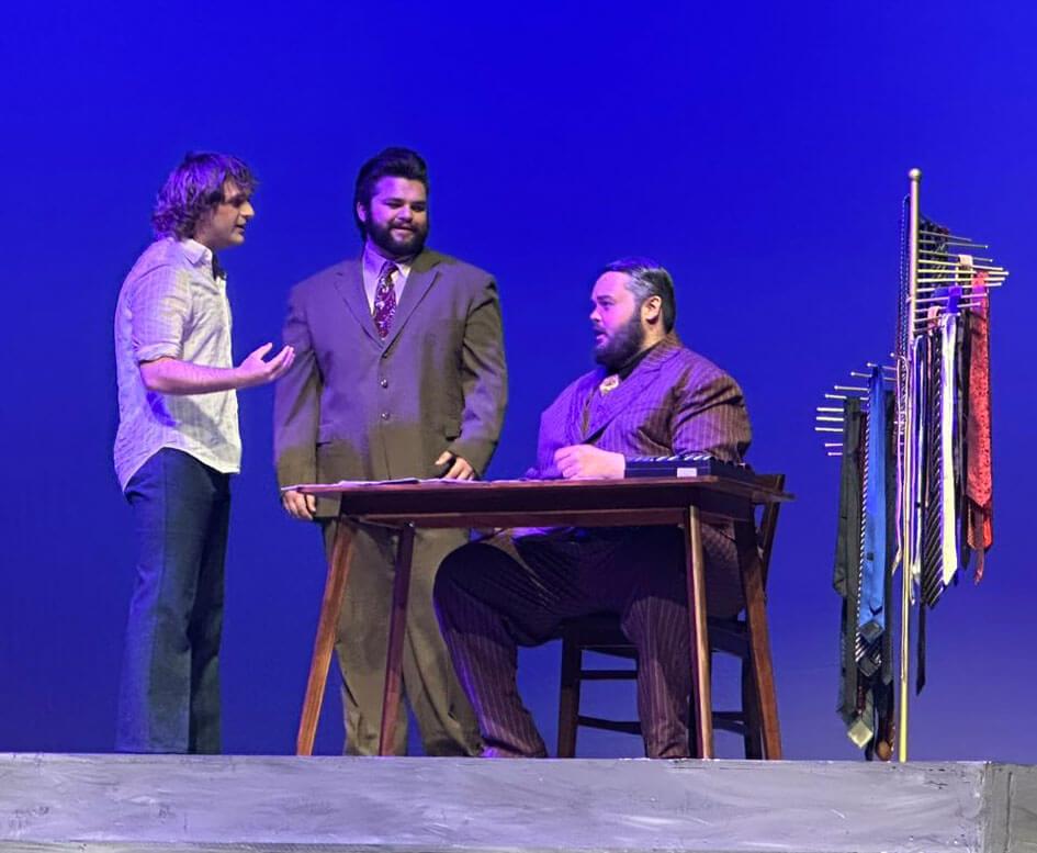 Zak performing on stage in a theatrical production